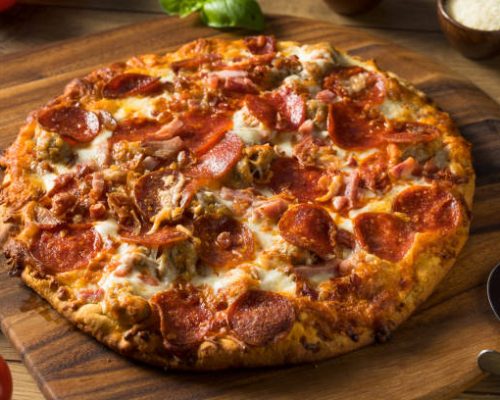 Savory Homemade Meat Lovers Pizza with Pepperoni and Bacon